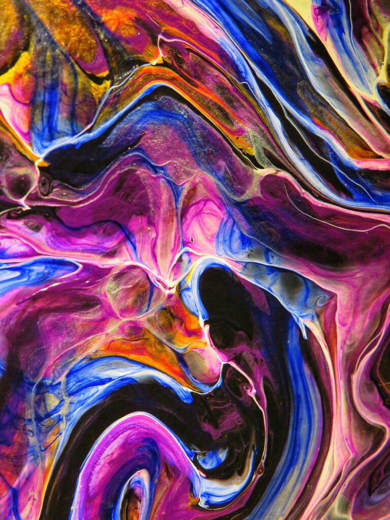 Dynamic and colorful abstract fluid art painting with vivid colors and swirling patterns.